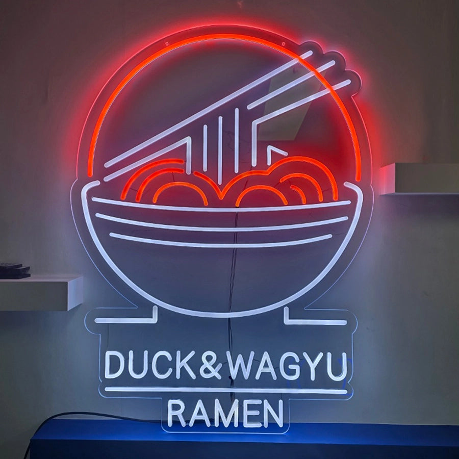 DUCK&WAGYUロゴのネオン看板。6mmと8mmのチューブ幅を使用し、オレンジとクールホワイトカラーで表現されたネオンサイン。