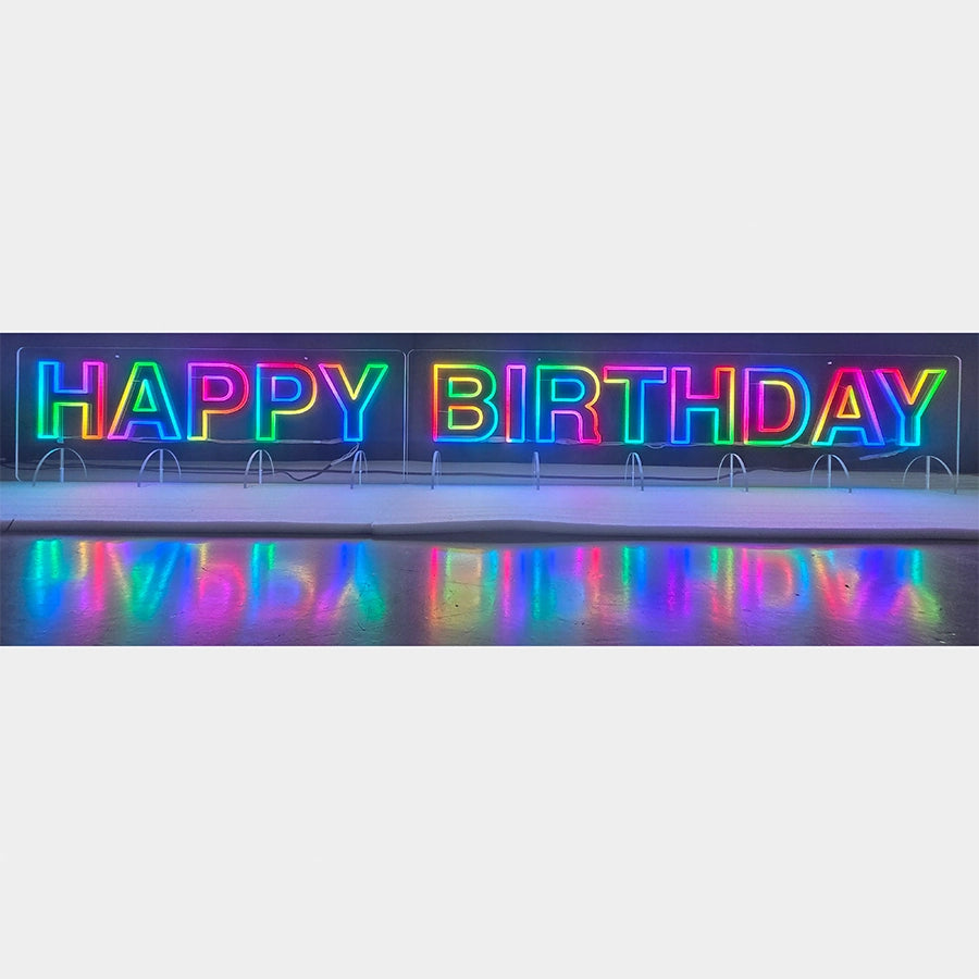 HAPPY BIRTHDAYロゴのネオン看板。リモコンによる変色機能付き仕様。長尺(横1150mm+1650mm)のため、背後にコントローラーを2つ取り付け、2つのリモコンで操作。